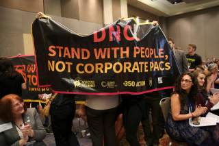 FILE PHOTO: Demonstrators with the group Sunrise Movement interrupt a resolutions meeting at the Democratic National Committee (DNC) Summer Meeting in Chicago, Illinois, U.S., August 23, 2018. REUTERS/Daniel Acker/File Photo