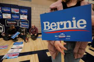 Supporters of Democratic 2020 U.S. presidential candidate and U.S. Senator Bernie Sanders (I-VT) wait at their caucus site in Des Moines, Iowa, U.S., February 3, 2020. Picture taken February 3, 2020. REUTERS/Brian Snyder