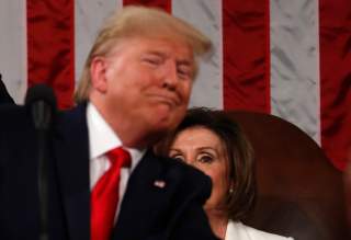 Speaker of the House Nancy Pelosi looks on as U.S. President Donald Trump delivers his State of the Union address to a joint session of the U.S. Congress in the House Chamber of the U.S. Capitol in Washington, U.S. February 4, 2020. REUTERS/Leah Millis