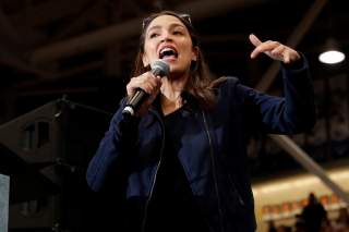 U.S. Representative Alexandria Ocasio Cortez (D-NY) speaks to introduce Democratic U.S. presidential candidate Senator Bernie Sanders at a campaign rally and concert at the University of New Hampshire one day before the New Hampshire presidential primary