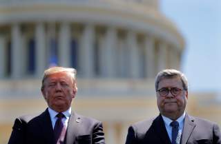 U.S. President Donald Trump and U.S. Attorney General William Barr attend the 38th Annual National Peace Officers Memorial Service on Capitol Hill in Washington, U.S., May 15, 2019. Picture taken May 15, 2019. REUTERS/Carlos Barria/Files