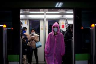 A woman wearing face mask is seen on a subway as the country is hit by an outbreak of the novel coronavirus, in Shanghai, China March 2, 2020. REUTERS/Aly Song