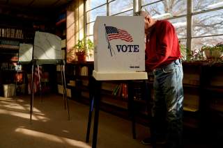 Percy C Wade III fills out his ballot at the Weleetka school library on Super Tuesday in Weleetka, Oklahoma, U.S., March 3, 2020. REUTERS/Nick Oxford