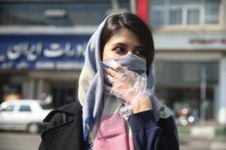 An Iranian woman wears a protective face mask, following the coronavirus outbreak, as she walks in Tehran, Iran March 5, 2020. WANA (West Asia News Agency)/Nazanin Tabatabaee via REUTERS