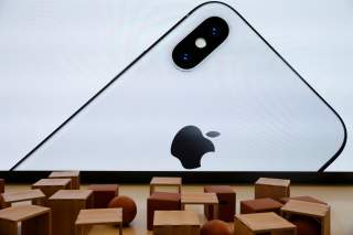 An iPhone X is seen on a large video screen in the new Apple Visitor Center in Cupertino, California, U.S., November 17, 2017. REUTERS/Elijah Nouvelage