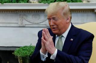 U.S. President Donald Trump gestures as he meets with Ireland's Prime Minister, Taoiseach Leo Varadkar in the Oval Office of the White House in Washington, U.S., March 12, 2020. REUTERS/Leah Millis