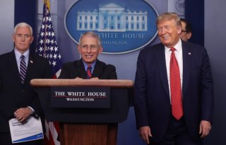 Dr. Anthony Fauci, Director of the National Institute of Allergy and Infectious Diseases, smiles as he addresses the coronavirus task force daily briefing with Vice President Mike Pence and President Donald Trump at the White House in Washington, U.S., Ma