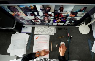 A student takes classes online with his companions using the Zoom APP at home during the coronavirus disease (COVID-19) outbreak in El Masnou, north of Barcelona, Spain April 2, 2020. REUTERS/ Albert Gee