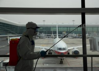 A firefighter in protective suit disinfects Wuhan Tianhe International Airport before the airport resumes its domestic flights on April 8, in Wuhan, Hubei province, the epicentre of China's novel coronavirus disease (COVID-19) outbreak, April 3, 2020. Chi