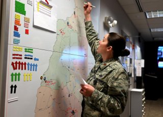 New Hampshire National Guard chief of operations Major Moira Cuthbert tracks coronavirus disease (COVID-19) missions at the Joint Operations Center in Concord, New Hampshire, U.S. April 2, 2020. Picture taken April 2, 2020. U.S. Air National Guard/Staff S