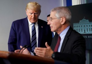 U.S. President Donald Trump reacts as he listens to National Institute of Allergy and Infectious Diseases Director Dr. Anthony Fauci address the daily coronavirus task force briefing at the White House in Washington, U.S., April 5, 2020. REUTERS/Joshua Ro
