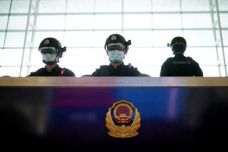 Police officers wearing face masks are seen at the Wuhan Tianhe International Airport after travel restrictions to leave Wuhan, the capital of Hubei province and China's epicentre of the novel coronavirus disease (COVID-19) outbreak, were lifted, April 8,