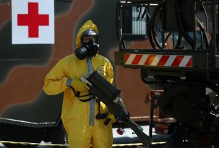 A Brazilian army officer and member of the Biological Radiological and Nuclear Chemical Defense Battalion, demonstrates tactics to combat the new coronavirus pandemic, amid the coronavirus disease (COVID-19) outbreak, at army headquarters in Rio de Janeir