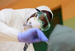 A medical worker takes a sample for COVID-19 during a community testing, as authorities race to contain the spread of coronavirus disease (COVID-19) in Abuja, Nigeria April 15, 2020. REUTERS/Afolabi Sotunde