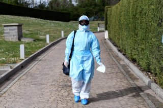 A doctor in protective suit is seen before entering a hotel where people suffering from the coronavirus disease (COVID-19) are quarantined, in Bergamo, the epicentre of Italy's outbreak, April 16, 2020. REUTERS/Flavio Lo Scalzo