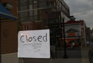 A closed sign is visible on the window of a business during the outbreak of the coronavirus (COVID-19) disease in Washington, U.S., April 29, 2020. REUTERS/Leah Millis