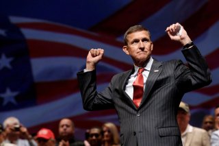 Retired U.S. Army Lieutenant General Michael Flynn reacts at a campaign event for then Republican presidential nominee Donald Trump in Virginia Beach, Virginia, U.S., September 6, 2016. Picture taken September 6, 2016. REUTERS/Mike Segar