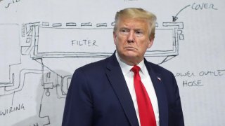 U.S. President Donald Trump pauses in front of a diagram while touring the Ford Rawsonville Components Plant, which is making ventilators and medical supplies, during the coronavirus disease (COVID-19) pandemic in Ypsilanti, Michigan, U.S., May 21, 2020. 