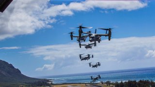 A flight of U.S. Marines MV-22B Osprey transport aircraft fly in formation during an integrated training mission at Marine Corps Air Station Kaneohe Bay near Kailua, Hawaii, U.S. May 19, 2020. Picture taken May 19, 2020. U.S. Marine Corps/Lance Cpl. Jacob