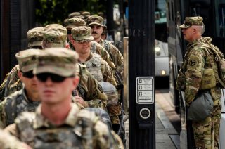 Uniformed military personnel walks into the secured White House area ahead of a protest against racial inequality in reaction to the death in Minneapolis police custody of George Floyd, in Washington, U.S., June 6, 2020. REUTERS/Lucas Jackson