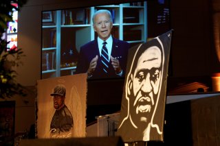 Democratic presidential candidate, former Vice President Joe Biden speaks via video link as family and guests attend the funeral service for George Floyd at The Fountain of Praise church Tuesday, June 9, 2020, in Houston. David J. Phillip/Pool via REUTERS