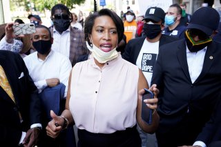 Washington, DC Mayor Muriel Bowser is surrounded by clergy as she speaks during a vigil as protests continue on the streets near the White House over the death in police custody of George Floyd, in Washington, U.S., June 3, 2020. REUTERS/Kevin Lamarque