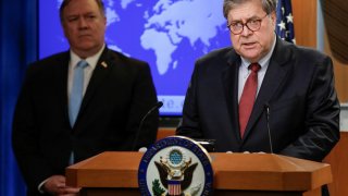 U.S. Attorney General Bill Barr speaks as Secretary of State Mike Pompeo listens during a joint briefing about an executive order from U.S. President Donald Trump on the International Criminal Court at the State Department in Washington, U.S., June 11, 20
