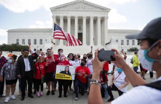 DACA recipients and their supporters celebrate outside the U.S. Supreme Court after the court ruled in a 5-4 vote that U.S. President Donald Trump's 2017 move to rescind the Deferred Action for Childhood Arrivals (DACA) program, created in 2012 by his Dem