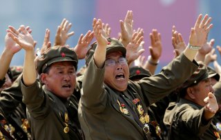 Korean War veterans react as they shout slogans to North Korean leader Kim Jong-un during a parade to mark the 60th anniversary of the signing of a truce in the 1950-1953 Korean War, at Kim Il-sung Square in Pyongyang, North Korea, July 27, 2013. REUTERS/