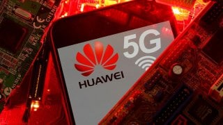 A smartphone with the Huawei and 5G network logo is seen on a PC motherboard in this illustration picture taken January 29, 2020. REUTERS/Dado Ruvic