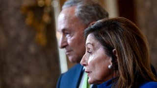 U.S. Speaker of the House Nancy Pelosi, joined by Senate Minority Leader Chuck Schumer, speaks to reporters in the U.S. Capitol in Washington, U.S. July 29, 2020. REUTERS/Erin Scott