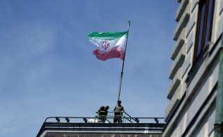 FILE PHOTO: The national flag of Iran is seen on top of the Austrian Chancellery during the visit of President Hassan Rouhani in Vienna, Austria July 4, 2018. REUTERS/Lisi Niesner/File Photo