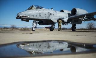 A member of the 100th Logistics Readiness Squadron refuels a 74th Expeditionary Fighter Squadron A-10C Thunderbolt II aircraft during forward area refueling point training at Plovdiv, Bulgaria, Feb. 11, 2016.