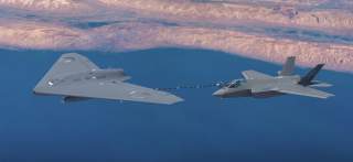 Lockheed Martin MQ-25 refuels a Lockheed Martin F-22 Raptor
