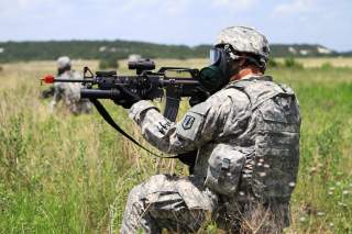 A Soldier from Headquarters and Headquarters Battery, 41st Fires Brigade, pulls security during the CBRN lane at the unit's pre-deployment training at Fort Hood, Texas.