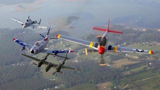 An A-10 Thunderbolt II, F-86 Sabre, P-38 Lightning and P-51 Mustang fly in a heritage flight formation during an air show at Langley Air Force Base, Va., on May 21. U.S. Air Force/Tech. Sgt. Ben Bloker.