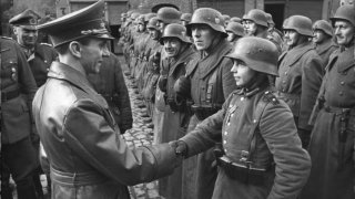 Goebbels awards a 16-year-old Hitler Youth, Willi Hübner, the Iron Cross for the defence of Lauban during the 