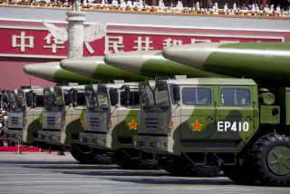 Military vehicles carrying DF-26 ballistic missiles travel past Tiananmen Gate during a military parade to commemorate the 70th anniversary of the end of World War II in Beijing Thursday Sept. 3, 2015. REUTERS/Andy Wong/Pool