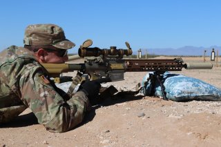 An Infantry Soldier along with 15 additional Soldiers assigned to Alpha Company, 4-17 Infantry Battalion, 1st Stryker Brigade Combat Team, 1st Armored Division, fires rounds down range with the newly developed Squad Designated Marksman Rifle (SDM-R), Jan.