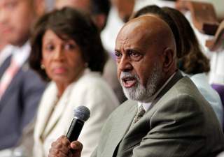 U.S. Rep. Alcee Hastings (R) of Florida speaks at a U.S. Congressional Black Caucus 'Town Meeting' at Mt. Hermon AME church in Miami Gardens, Florida August 22, 2011, as U.S. Rep. Maxine Waters of California watches. REUTERS/Joe Skipper