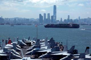 Fighter jets are seen on the deck of U.S. carrier USS George Washington as it stations off Hong Kong waters during a routine port visit to the territory July 10, 2012. REUTERS/Bobby Yip