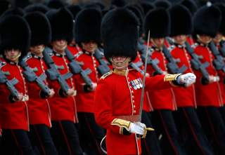 Guardsmen of the Grenadier Guards parade during the Trooping the Colour ceremony at Horse Guards Parade in London June 14, 2014. Trooping the Colour is a ceremony to honour the Queen's official birthday. REUTERS/Luke MacGregor