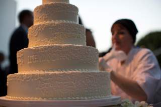 A wedding cake is decorated with messages from guests at a ceremony to celebrate the wedding of Paul Katami and Jeff Zarrillo at Beverly Hilton Hotel in Beverly Hills, California June 28, 2014. 