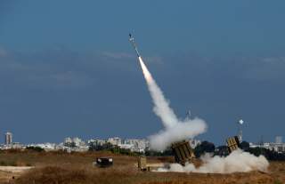 An Iron Dome launcher fires an interceptor rocket in the southern Israeli city of Ashdod July 9, 2014. At least two rockets fired from the Gaza Strip at Tel Aviv on Wednesday were shot down mid-air by Israel's Iron Dome defense system, the Israeli militar