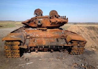 A destroyed T-72 tank, which presumably came from Russia, is seen on a battlefield near separatist-controlled Starobesheve, eastern Ukraine, October 2, 2014. The burnt-out remains of dozens of tanks and armoured vehicles in fields near the small village o