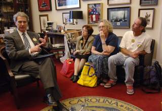 U.S. Representative Walter Jones (L) (R-NC), meets with Gold Star and Military Families in his Capitol Hill office in Washington, D.C., June 15, 2005. Seated are (L-R) Dianne Davis Santorello, mother of Lt. Neil Santorello; Celeste Zappala, mother of Sgt.
