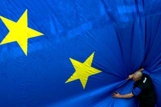 A worker adjusts a 150 metre-square European flag during a celebration in Brussels' Jubilee Park to mark the expansion of the European Union to 25 from 15 states on April 30, 2004. Cyprus, the Czech Republic, Estonia, Hungary, Latvia, Lithuania, Malta, Po