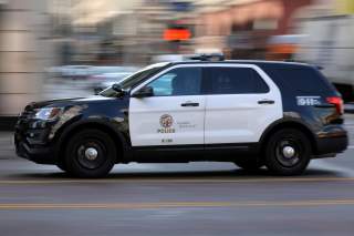 A Los Angeles Police Department cruiser with lights and sirens going speeds down on a city street in Los Angeles, California, U.S. August 10, 2017. REUTERS/Mike Blake