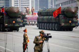 Intercontinental ballistic missiles (ICBM) are driven past the stand with North Korean leader Kim Jong Un and other high ranking officials during a military parade marking the 105th birth anniversary of country's founding father Kim Il Sung, in Pyongyang 