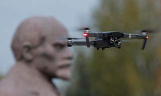 A drone flies near a monument of Soviet state founder Vladimir Lenin at the Muzeon Arts Park in Moscow, Russia October 28, 2017. Picture taken October 28, 2017. REUTERS/Maxim Shemetov